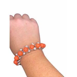 Anthropologie coral orange and crystal beaded bracelet